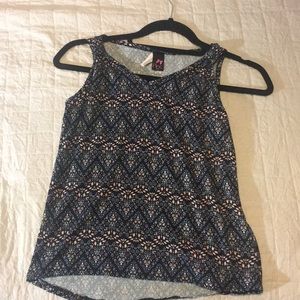A kids patterned v-necked shirt.